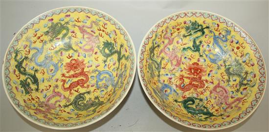 A pair of Chinese enamelled porcelain nine dragon bowls, Republic period, 21cm